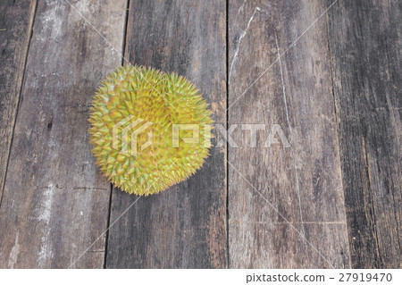 durian ripe which has thorn on wood background durian ripe which has thorn on wood background 27919470