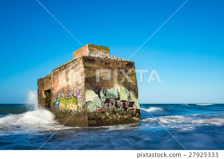 Bunker on shore of the Baltic Sea on a stormy day Bunker on shore of the Baltic Sea on a stormy day 27925333