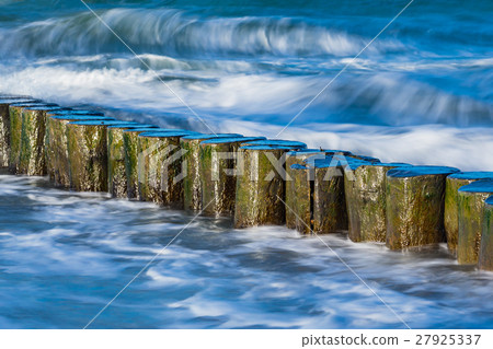 Groynes on shore of the Baltic Sea on a stormy day 27925337
