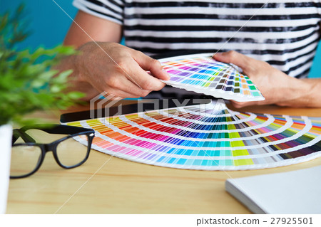 Graphic designer choosing a color 27925501