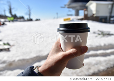 drinking a cup of coffee outside in the snow 27925674