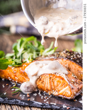 Grilled salmon, sesame seeds herb decoration. Grilled salmon, sesame seeds herb decoration. 27930831
