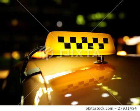 Yellow taxi sign checker at night 27931454