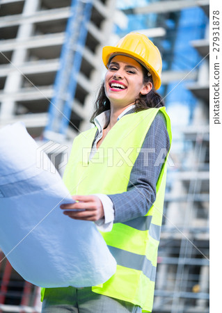 Female civil engineer studying drafts Female civil engineer studying drafts 27931878