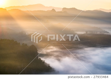 Scenic landscape on foggy hill at sunrise 27933464