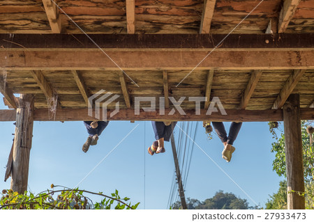 Tourists group sitting hanging legs on terrace 27933473