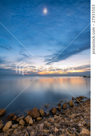 Beautiful coast sea with the moon at twilight Beautiful coast sea with the moon at twilight 27933503