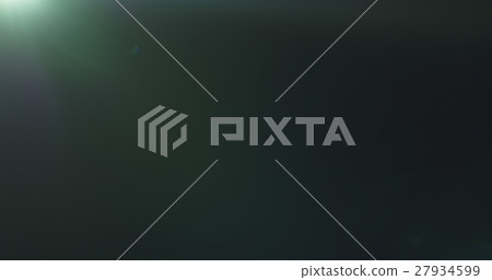 green lens flare artifacts over black background 27934599