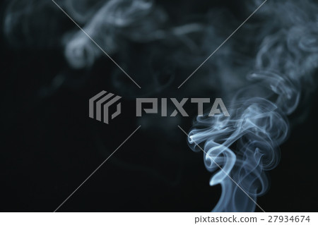 mystery dense blue smoke over dark background mystery dense blue smoke over dark background 27934674