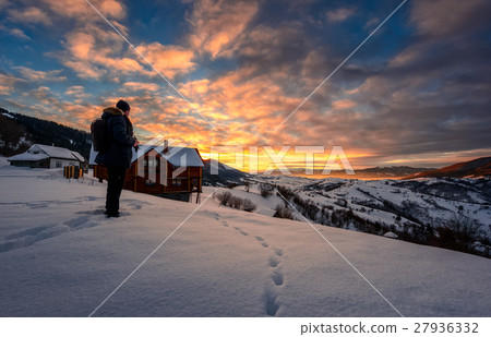 photographer looking in to the winter sunrise photographer looking in to the winter sunrise 27936332