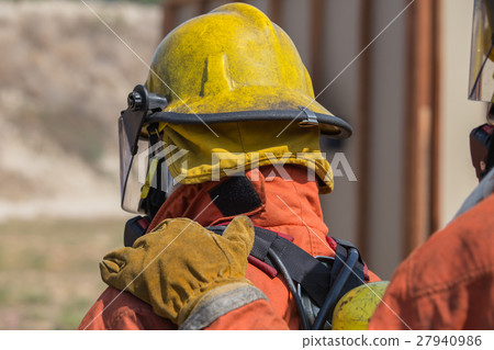 firefighter hand on shoulder of first man signal 27940986
