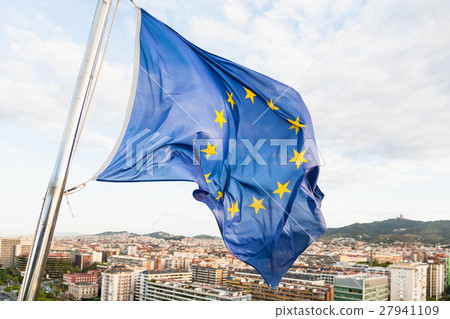 EU flag fluttering by wind above Barcelona 27941109