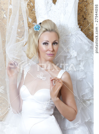 beautiful woman, the bride, near wedding dress beautiful woman, the bride, near wedding dress 27944898