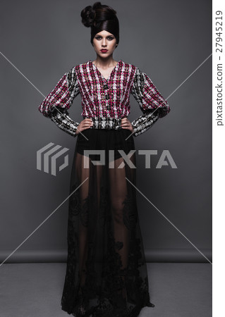 Beautiful girl in evening dress with avant-garde 27945219
