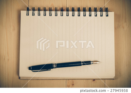 Fountain pen on notebook 27945938
