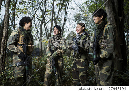 Men and women playing survival games Men and women playing survival games 27947194