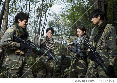 Men and women playing survival games Men and women playing survival games 27947195