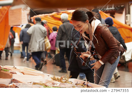 A woman sightseeing in morning market A woman sightseeing in morning market 27947355