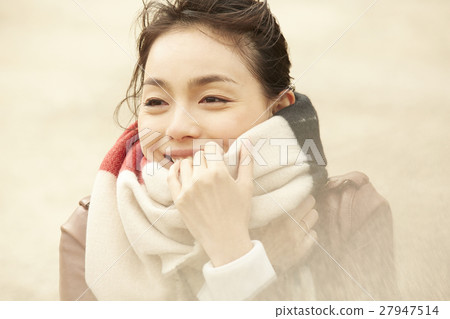 A woman walking in a port city Portrait 27947514