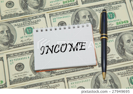Notebook page with text INCOME on dollar backgroun 27949695