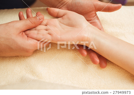 Palmist reading future through study of palm 27949973