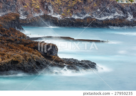 blur water surrounding rocks, long time exposure blur water surrounding rocks, long time exposure 27950235