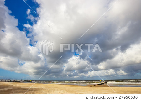 Sandy yellow beach with cloudy sky, Baltic Sea 27950536