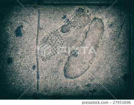 Foot print on concrete foot path bridge 27951696