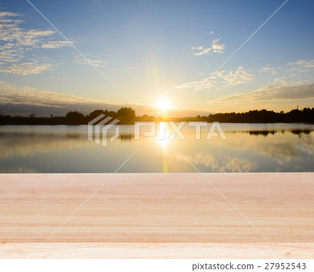 Wooden board empty table sea and sky sunset backgr Wooden board empty table sea and sky sunset backgr 27952543