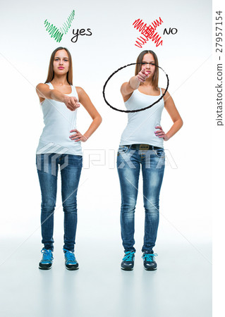 conceptual portrait of two beautiful twin young 27957154