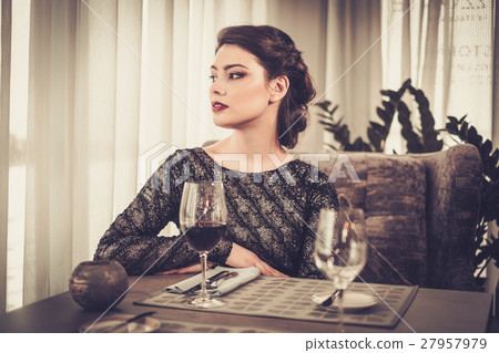 Attractive sensual young lady with glass of wine 27957979