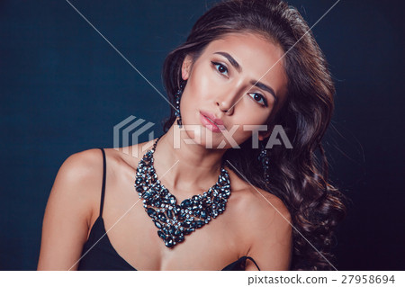 Brunette girl with a beautiful necklace and 27958694