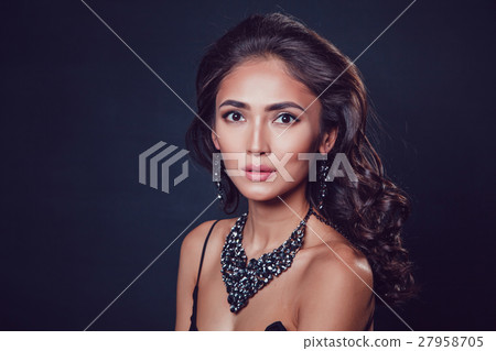 Brunette girl with a beautiful necklace and Brunette girl with a beautiful necklace and 27958705
