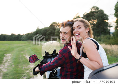 Couple in love enjoying a motorbike ride in Couple in love enjoying a motorbike ride in 27959403