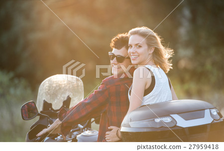 Couple in love enjoying a motorbike ride in Couple in love enjoying a motorbike ride in 27959418