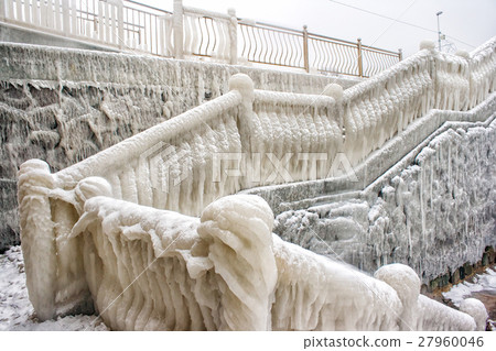 ice covered staircase on the beach 27960046