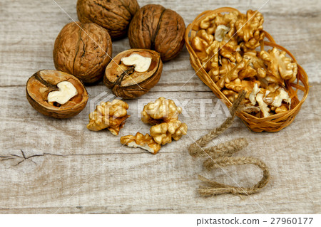 Whole walnuts and kernels on the table 27960177