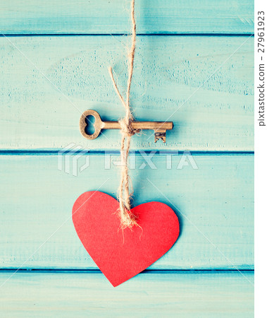 Skeleton key and heart hanging over turquoise wood Skeleton key and heart hanging over turquoise wood 27961923