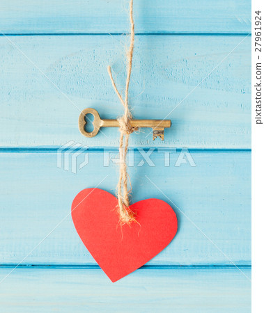 Skeleton key and heart hanging over turquoise wood Skeleton key and heart hanging over turquoise wood 27961924