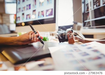 Graphic designer using graphic tablet Graphic designer using graphic tablet 27963476