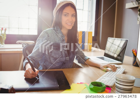 Graphic designer using graphics tablet Graphic designer using graphics tablet 27963478