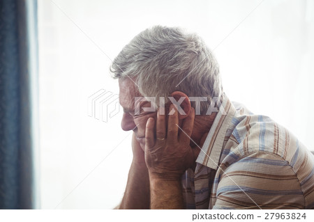 Sad senior man sitting Sad senior man sitting 27963824