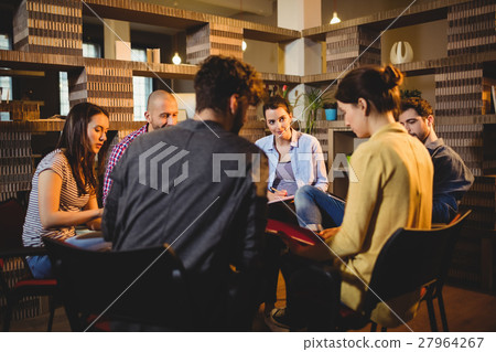 Colleagues having discussion Colleagues having discussion 27964267