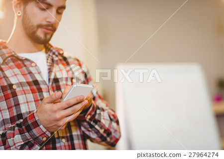 Male graphic designer using mobile phone 27964274