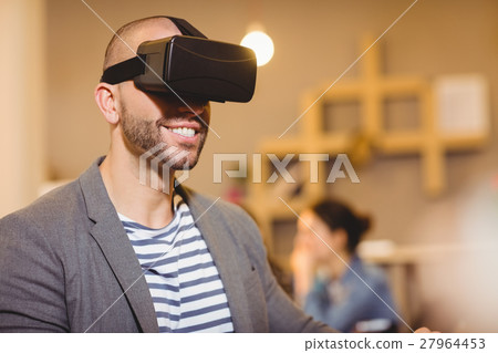 Male graphic designer wearing virtual glasses Male graphic designer wearing virtual glasses 27964453
