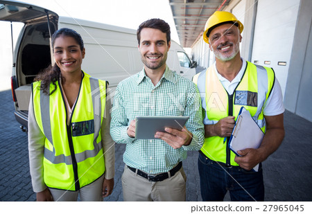 Manager and workers are smiling and posing face to the camera Manager and workers are smiling and posing face to the camera 27965045