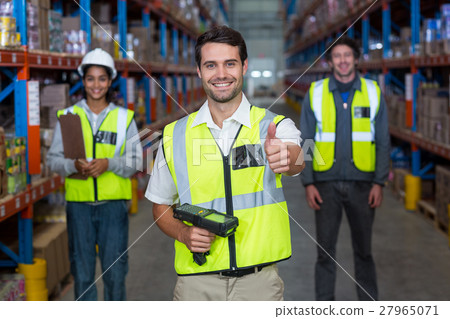 Worker with thumb up wearing yellow safety vest Worker with thumb up wearing yellow safety vest 27965071