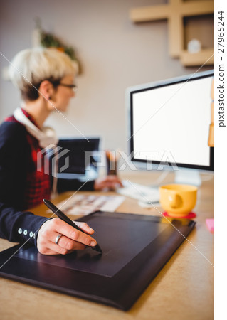 Graphic designer using graphics tablet Graphic designer using graphics tablet 27965244