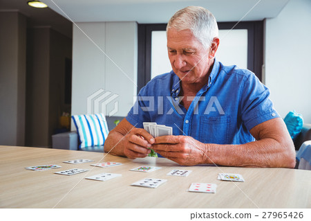 Senior man playing cards 27965426
