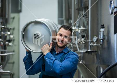 Portrait of brewer carrying keg Portrait of brewer carrying keg 27965505